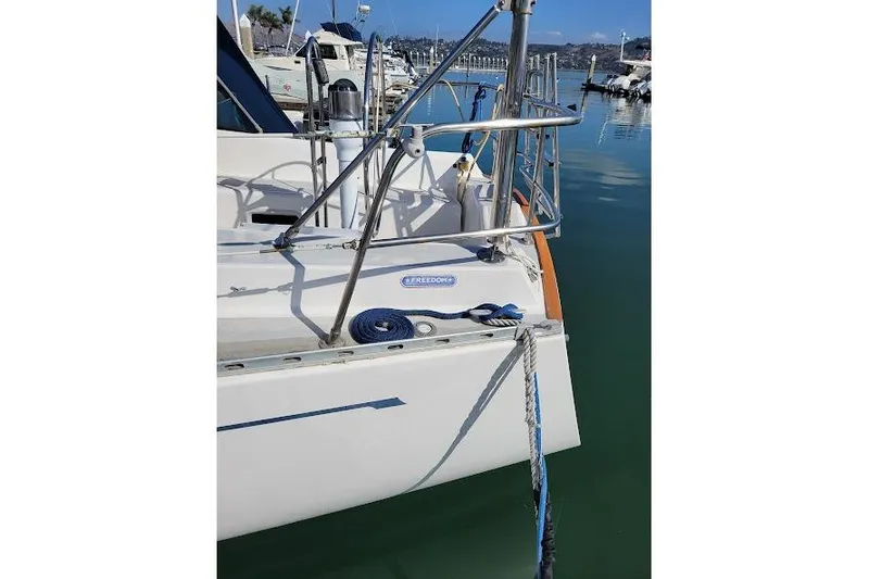 Slide: The Image of 1988 Freedom Yachts FREEDOM 36 sailboat docked in marina, rear view. - 3