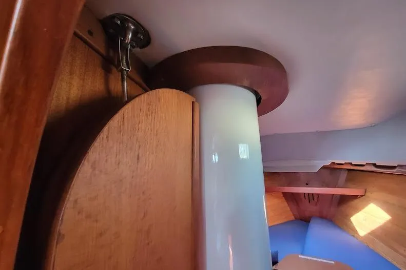 Slide: The Image of Interior view of 1988 Freedom Yachts FREEDOM 36 sailboat, showcasing wooden and fiberglass elements. - 32