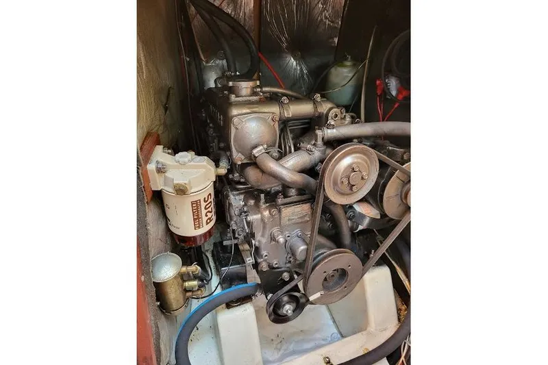 Slide: The Image of Engine compartment of a 1988 Freedom Yachts FREEDOM 36 sailboat, showcasing mechanical components. - 34