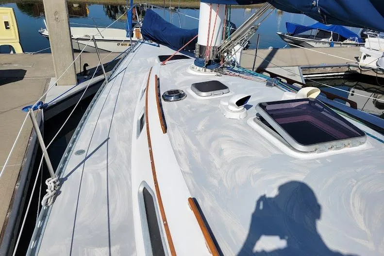 Slide: The Image of 1988 Freedom Yachts FREEDOM 36 sailboat showing sculptured deck art - 4