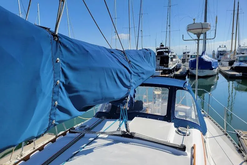 Slide: The Image of 1988 Freedom Yachts FREEDOM 36 sailboat sail cover functioning but will need replacing soon - 7