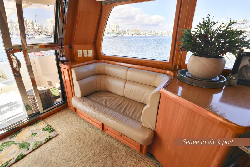 Slide: The Image of Luxurious interior of 2004 McKinna 57 Pilothouse with leather settee and scenic marina view. - 17