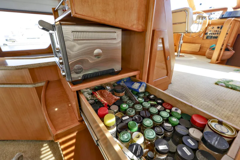Slide: The Image of Drawer with spices and toaster in 2004 McKinna 57 Pilothouse yacht kitchen. - 25