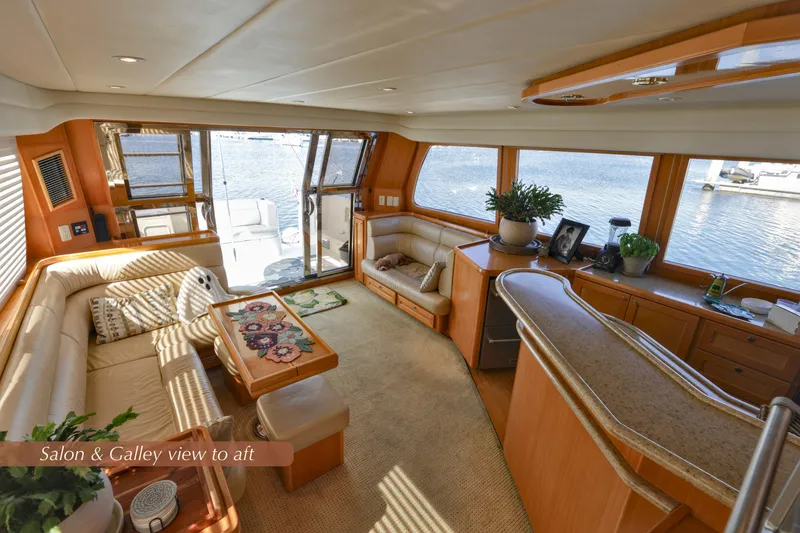 Slide: The Image of Luxurious 2004 McKinna 57 Pilothouse yacht interior with elegant salon and galley, water view. - 30