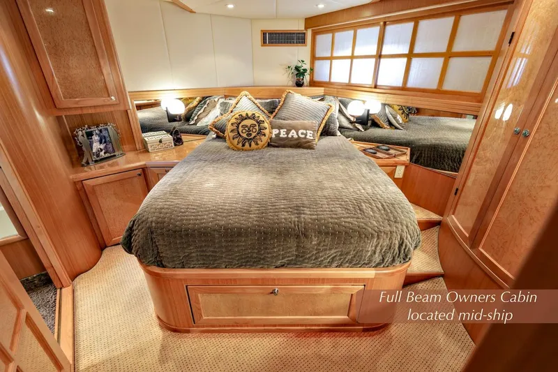 Slide: The Image of Luxurious 2004 McKinna 57 Pilothouse full beam owner's cabin with elegant wood finishes. - 31