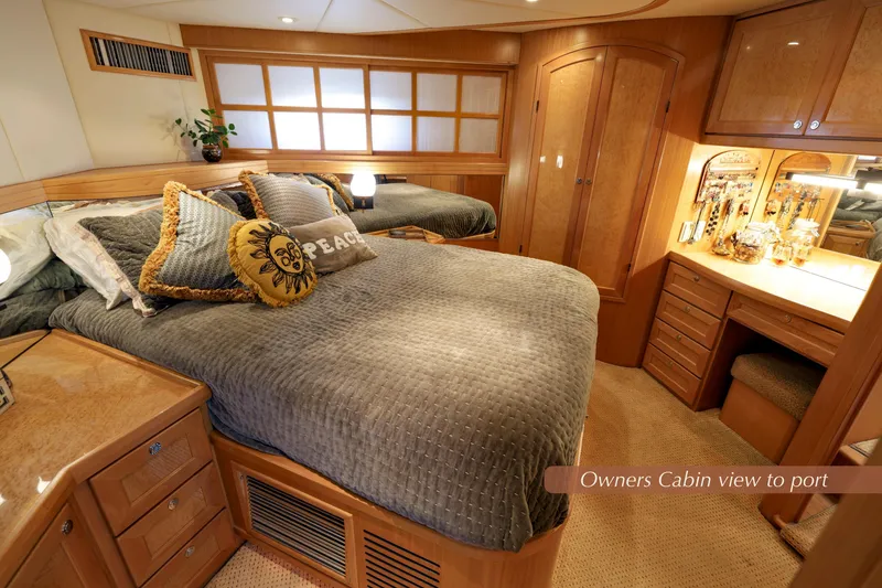 Slide: The Image of Luxurious 2004 McKinna 57 Pilothouse owner's cabin with elegant wood furnishings. - 32