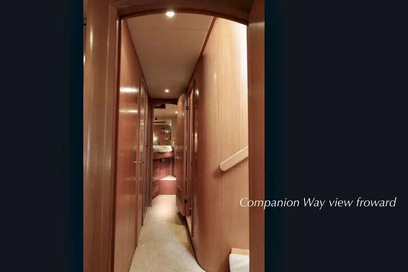Slide: The Image of 2004 McKinna 57 Pilothouse interior, companionway view, showcasing elegant wood paneling. - 41