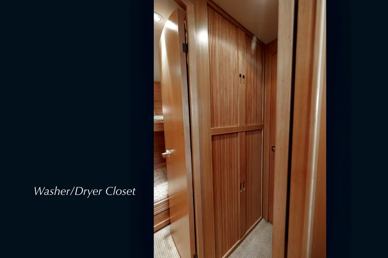 Slide: The Image of 2004 McKinna 57 Pilothouse interior with wooden washer/dryer closet. - 45