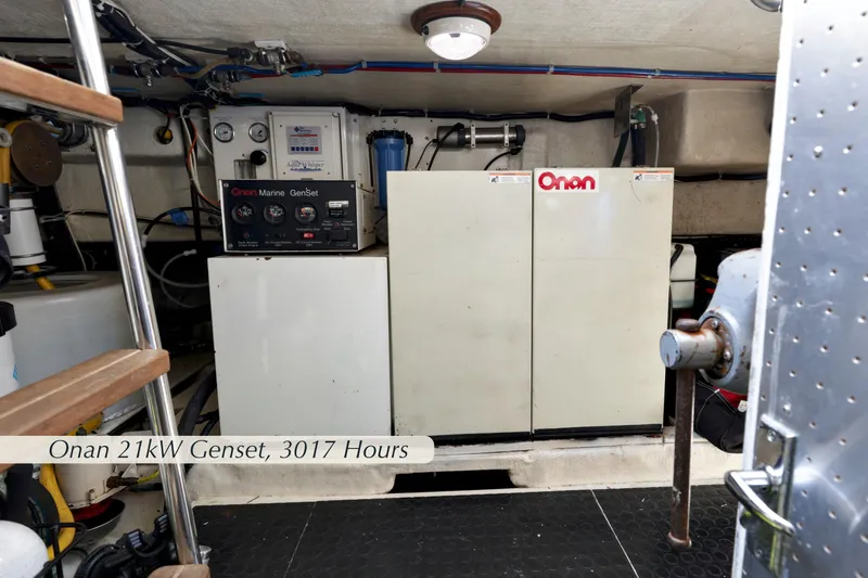 Slide: The Image of Engine room of 2004 McKinna 57 Pilothouse with Onan 21kW Genset, 3017 hours. - 48