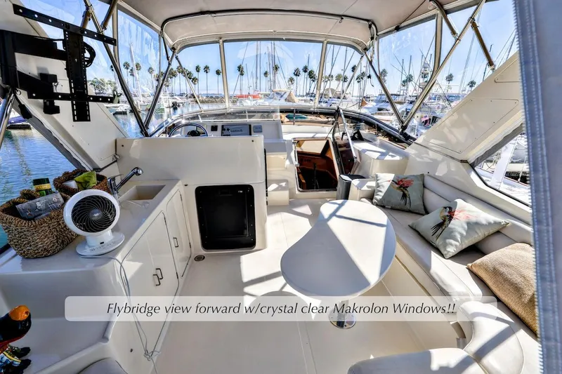 Slide: The Image of Flybridge of 2004 McKinna 57 Pilothouse with clear Makrolon windows, marina view. - 7