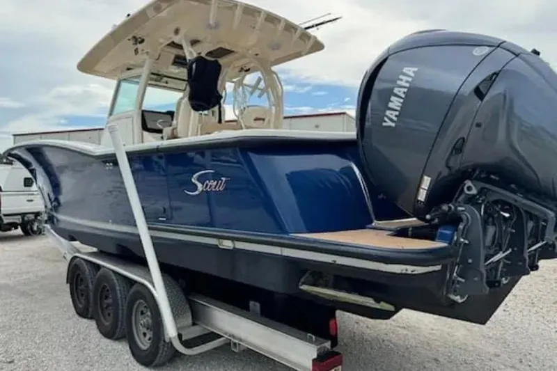 Slide: The Image of 2017 Scout 350 LXF boat with Yamaha engine on a trailer. - 54