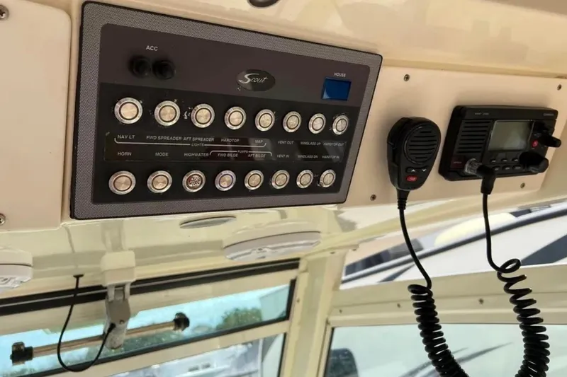 Slide: The Image of Control panel and radio equipment on a 2017 Scout 350 LXF boat. - 61