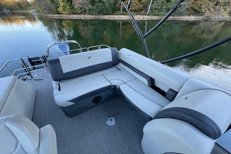 Slide: The Image of Luxurious seating on 2025 Starcraft EXS 3 Q DH boat, overlooking serene lake waters. - 4