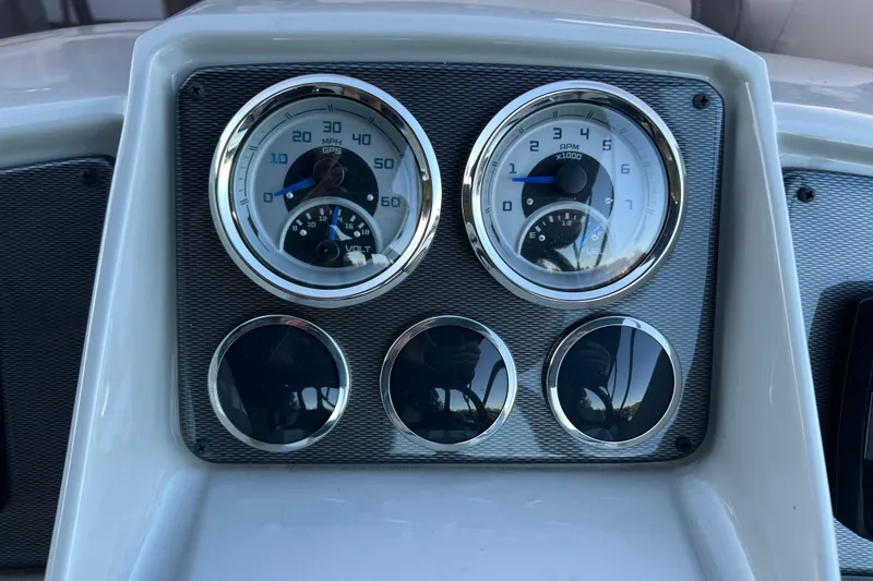 Slide: The Image of Dashboard of 2025 Starcraft EXS 3 Q DH boat with speedometer and tachometer. - 8