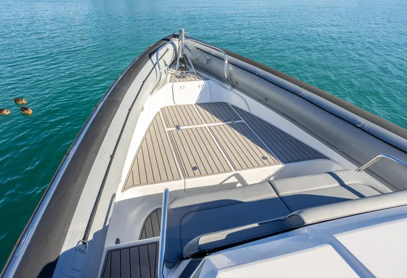 Slide: The Image of 2025 Protector 380 Targa boat deck with sleek design on calm blue water. - 10
