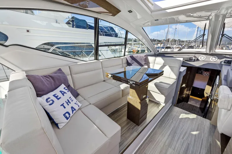 Slide: The Image of Luxurious interior of 2019 Cruisers Yachts 54 Cantius with elegant seating and table. - 31