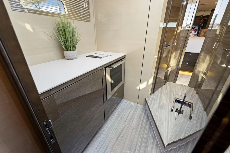 Slide: The Image of Luxurious interior of 2019 Cruisers Yachts 54 Cantius with modern cabinetry and sleek design. - 47