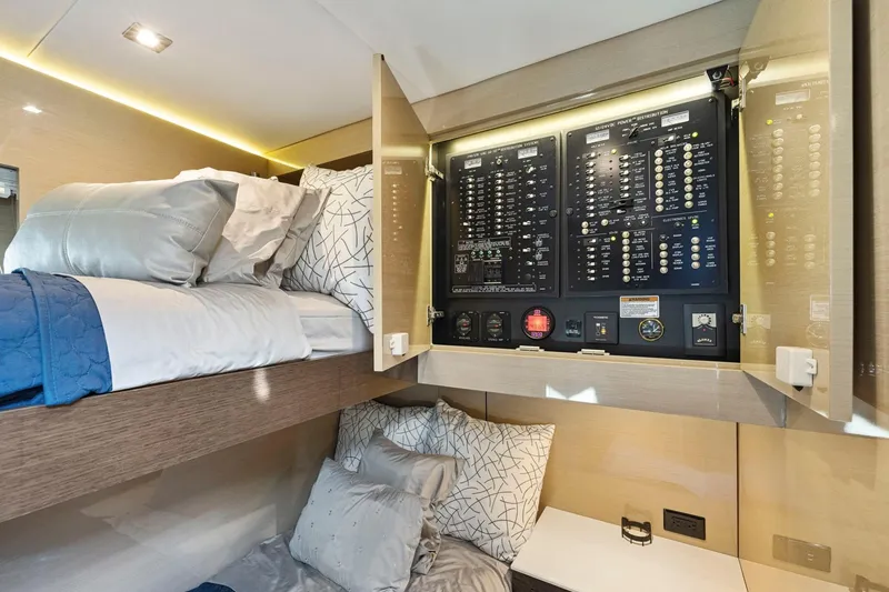 Slide: The Image of 2019 Cruisers Yachts 54 Cantius cabin with bunk beds and electrical panel. - 69