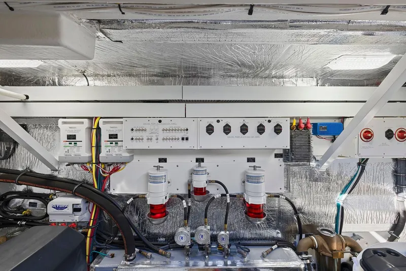 Slide: The Image of Engine room of 2019 Cruisers Yachts 54 Cantius with control panels and wiring. - 75