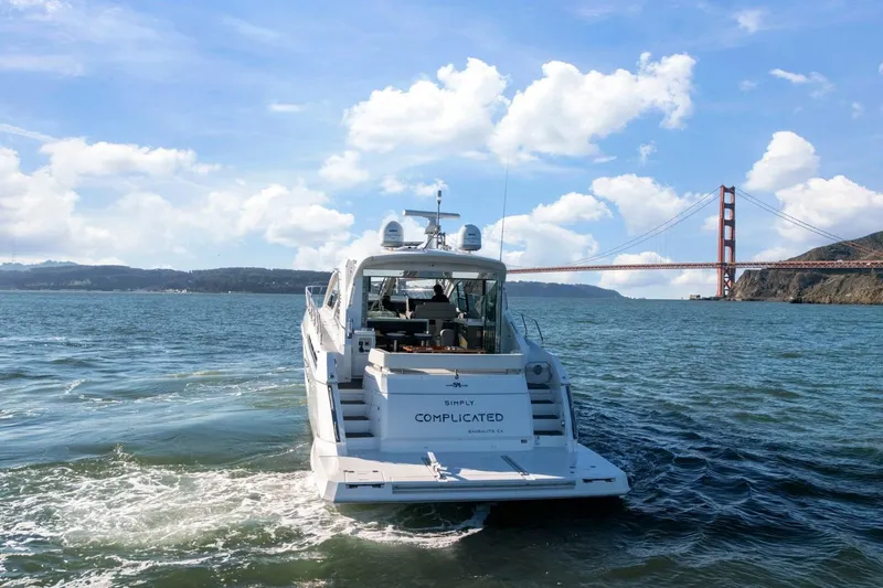 Slide: The Image of 2019 Cruisers Yachts 54 Cantius cruising near Golden Gate Bridge under blue skies. - 80