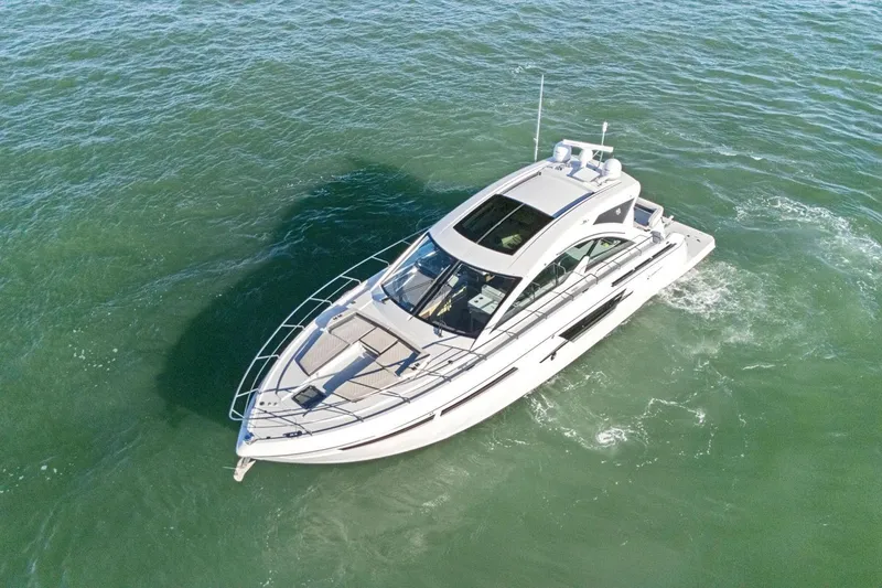 Slide: The Image of 2019 Cruisers Yachts 54 Cantius cruising on open water, aerial view. - 91