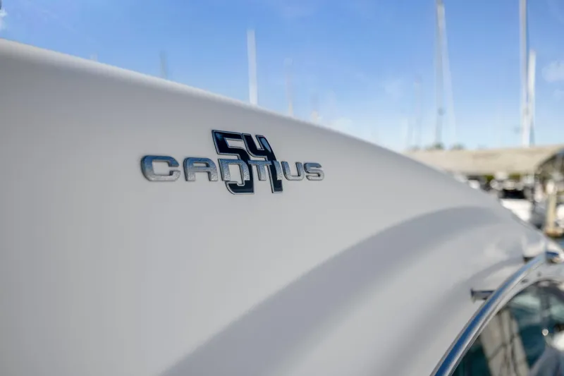 Slide: The Image of 2019 Cruisers Yachts 54 Cantius logo on sleek white hull. - 13