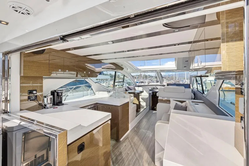Slide: The Image of Luxurious interior of 2019 Cruisers Yachts 54 Cantius with modern design and marina view. - 24