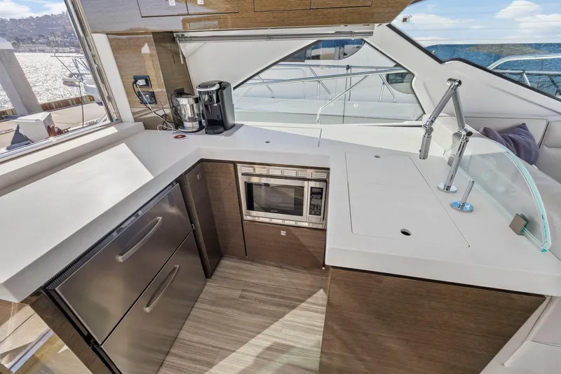 Slide: The Image of Luxurious 2019 Cruisers Yachts 54 Cantius kitchen with modern appliances and sleek design. - 25