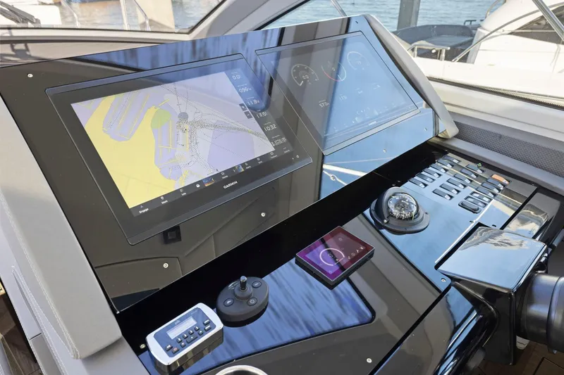 Slide: The Image of 2019 Cruisers Yachts 54 Cantius helm with advanced navigation system and controls. - 40