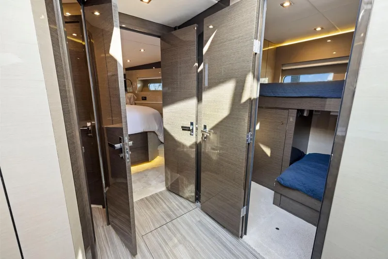 Slide: The Image of Luxurious interior of 2019 Cruisers Yachts 54 Cantius with modern bedroom and bunk beds. - 48