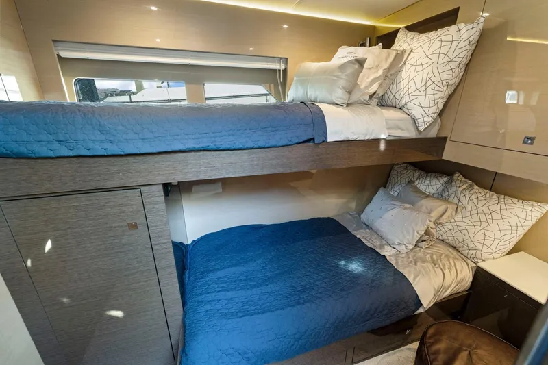 Slide: The Image of 2019 Cruisers Yachts 54 Cantius cabin with bunk beds and modern decor. - 50