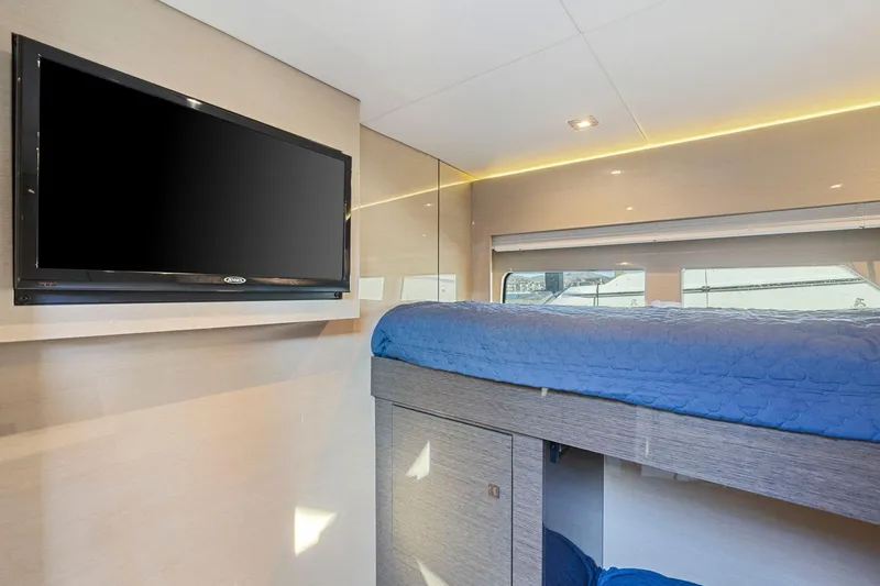 Slide: The Image of Interior of 2019 Cruisers Yachts 54 Cantius with TV and bunk bed. - 51