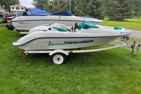 The Image of 1997 Sea-Doo Switch Sport Compact boat on trailer, parked on grass. - 1