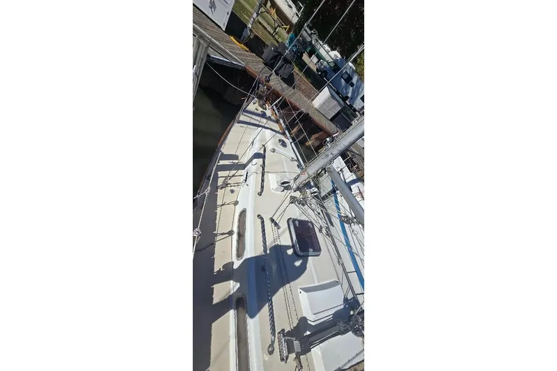 Slide: The Image of 1978 Tartan T34c sailboat deck with rigging and shadow. - 18
