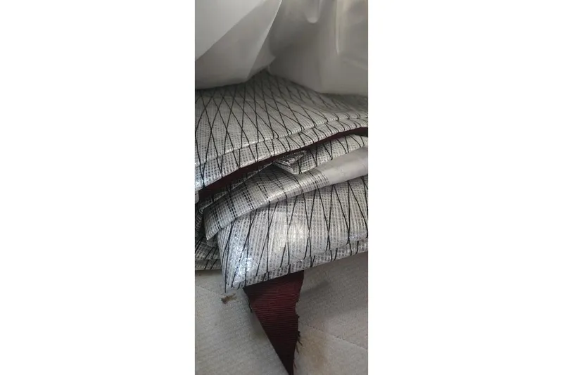 Slide: The Image of Folded sailcloth with grid pattern from a 1978 Tartan T34c sailboat. - 32