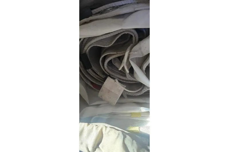Slide: The Image of Rolled sailcloth inside a 1978 Tartan T34c sailboat. - 41