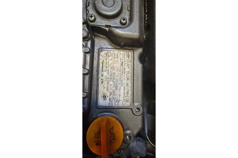 Slide: The Image of Close-up of a 1978 Tartan T34c engine with visible information plate. - 60