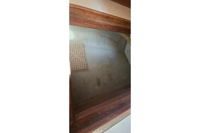 Slide: The Image of Interior view of a 1978 Tartan T34c sailboat, showcasing wooden and fiberglass elements. - 77