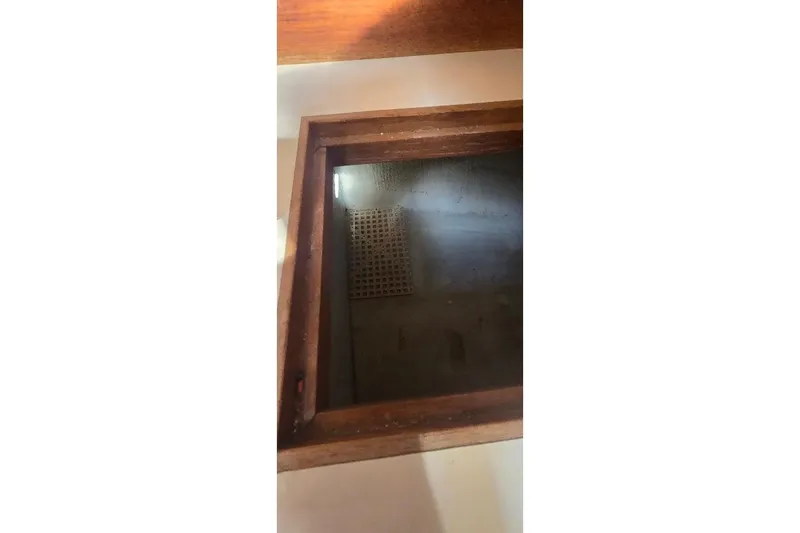 Slide: The Image of Wooden hatch interior of 1978 Tartan T34c sailboat, showcasing craftsmanship and design. - 78