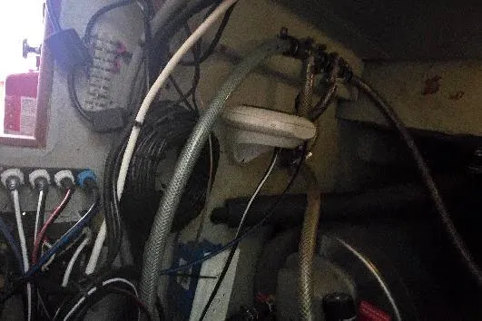 Slide: The Image of Interior of a 1978 Tartan T34c sailboat showing wiring and plumbing components. - 81