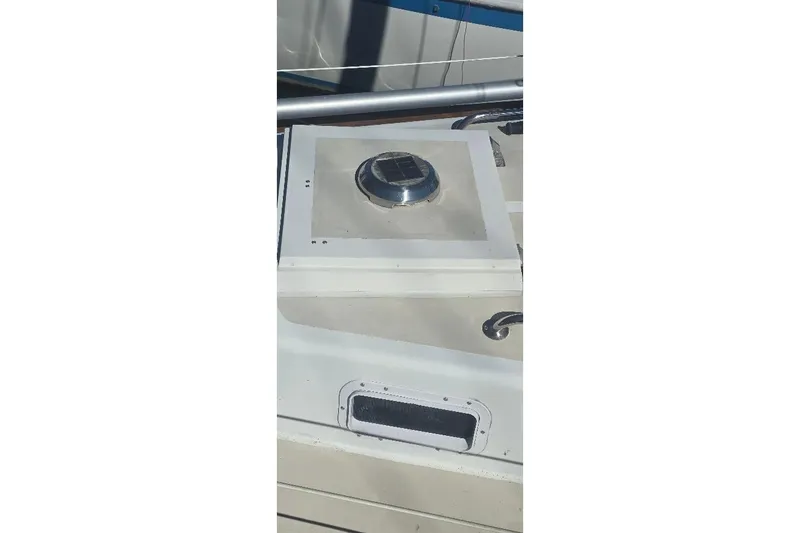 Slide: The Image of 1978 Tartan T34c sailboat deck with hatch and railing details. - 11