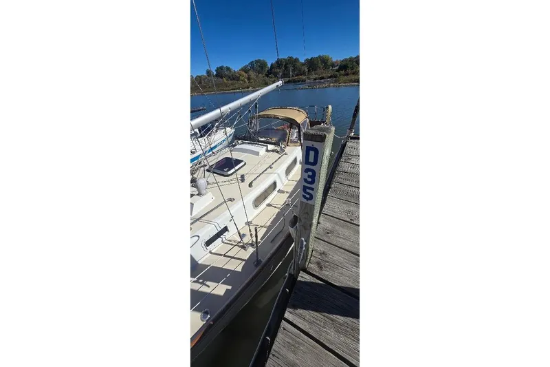 Slide: The Image of 1978 Tartan T34c sailboat docked at pier D35 on a sunny day. - 13