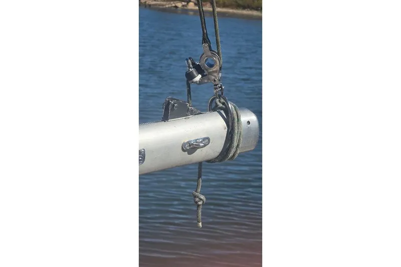 Slide: The Image of Close-up of a 1978 Tartan T34c sailboat rigging over water. - 16