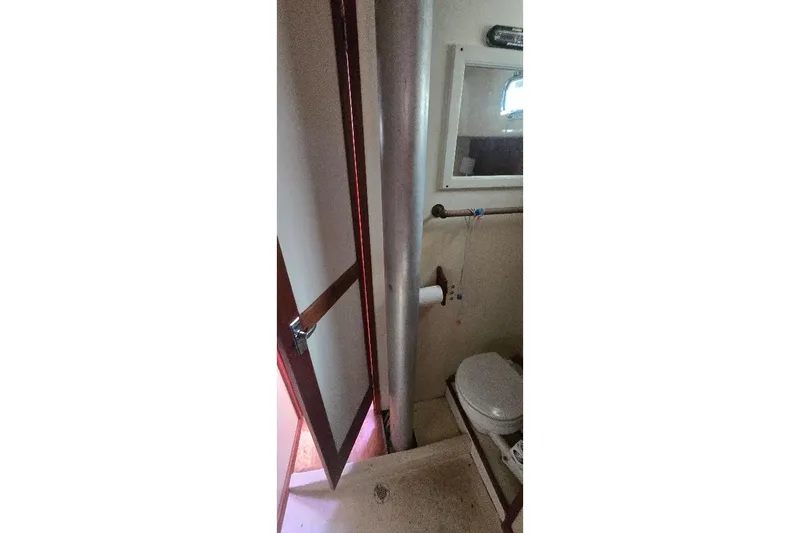 Slide: The Image of 1978 Tartan T34c yacht bathroom interior with toilet and mirror. - 26