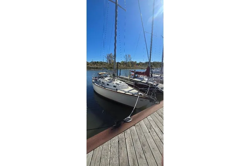 Slide: The Image of 1978 Tartan T34c sailboat docked on a sunny day. - 3