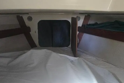 Slide: The Image of Interior cabin of a 1978 Tartan T34c sailboat with wooden accents. - 31