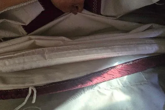 Slide: The Image of Close-up of Tartan T34c sailboat sail, showcasing stitching and fabric details, 1978 model. - 38