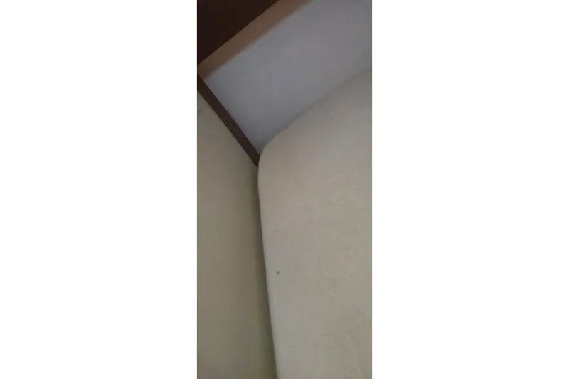 Slide: The Image of Interior corner of a Tartan T34c sailboat, 1978 model, showing upholstery and wood trim. - 39