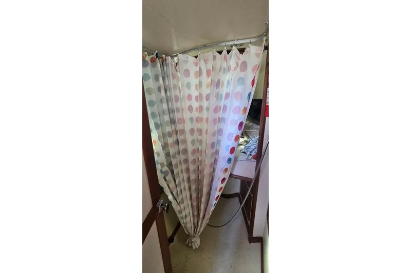 Slide: The Image of Polka dot shower curtain in 1978 Tartan T34c sailboat interior. - 44