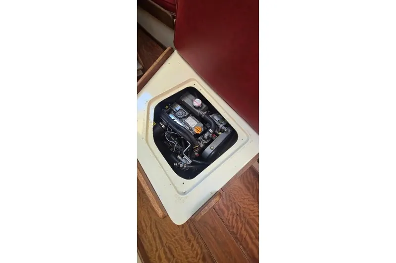 Slide: The Image of Engine compartment of a 1978 Tartan T34c sailboat, featuring visible mechanical components. - 57